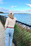 Lifestyle photo, Breast Cancer Awareness Cap, back of the hat, showing the symbol