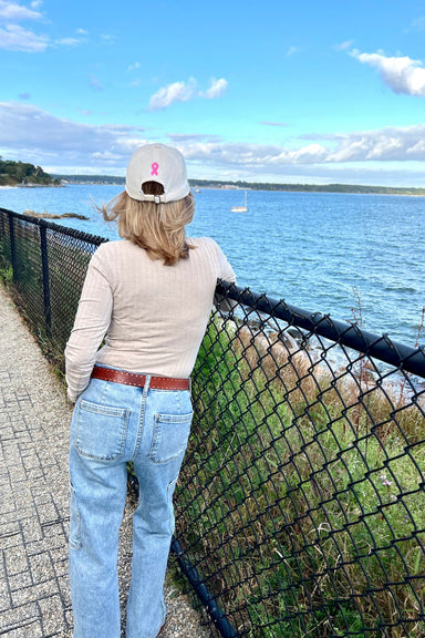 Lifestyle photo, Breast Cancer Awareness Cap, back of the hat, showing the symbol